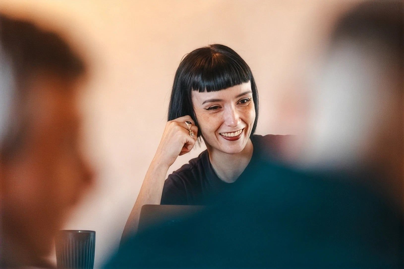 A team member smiling during a meeting.